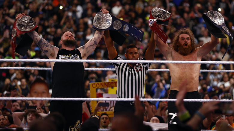 Sami Zayn & Kevin Owens arms raised