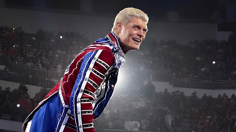 Cody Rhodes wearing red, white and blue ring attire while standing on ring ropes