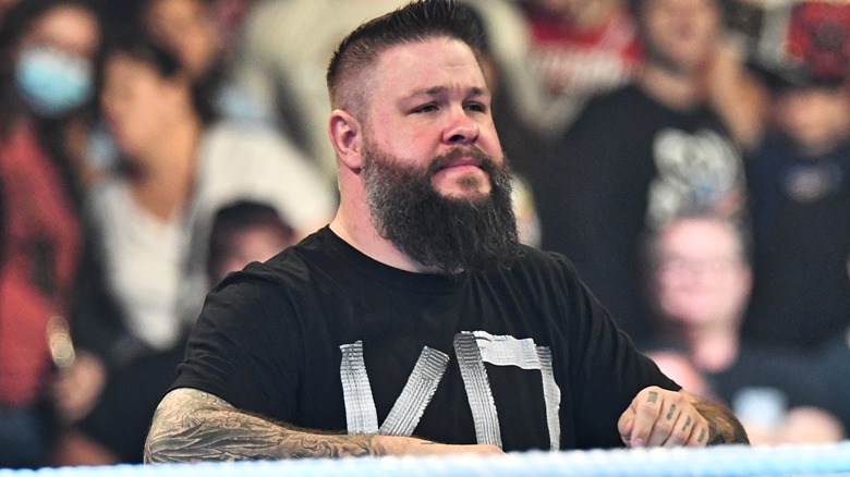 kevin owens smiling in black KO T-shirt