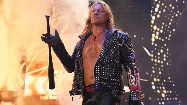 Chris Jericho walking to the ring with baseball bat