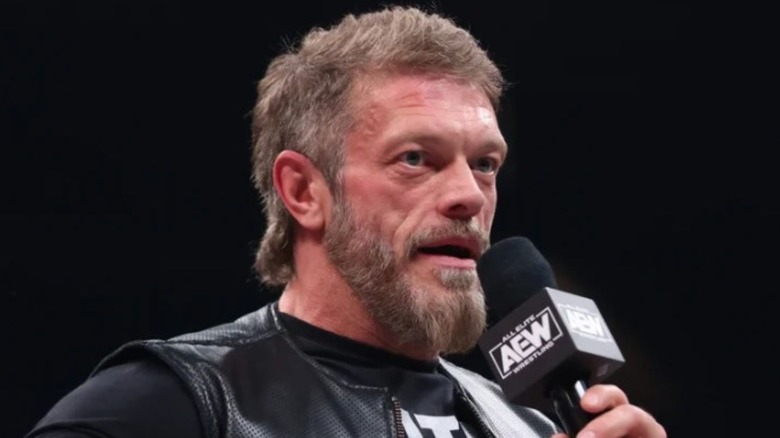 AEW's Adam Copeland, formerly known as "Edge" in WWE, deliver a promo in an AEW ring. 