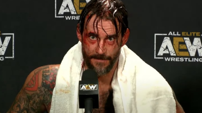 CM Punk with a microphone