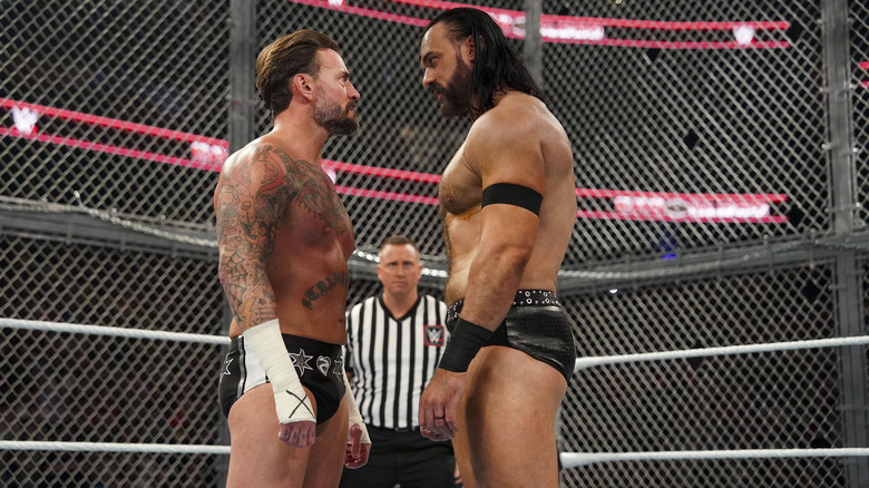 CM Punk and Drew McIntyre stare each other down inside Hell in a Cell at WWE Bad Blood