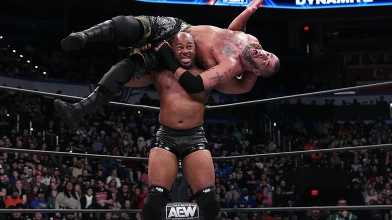 Jay Lethal with Mark Briscoe on his shoulders