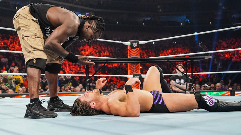 R-Truth waves his hand between his face and JD McDonagh