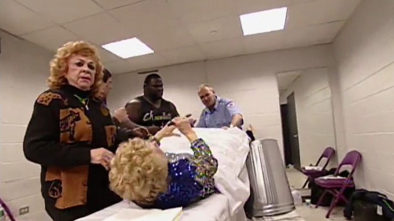 Mae Young delivers a hand