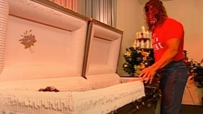 Triple H next to Katie Vick's casket