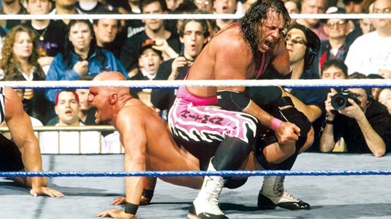 Bret Hart holds Steve Austin in The Sharpshooter