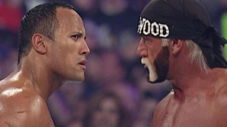 The Rock and Hulk Hogan stare each other down at WrestleMania 18