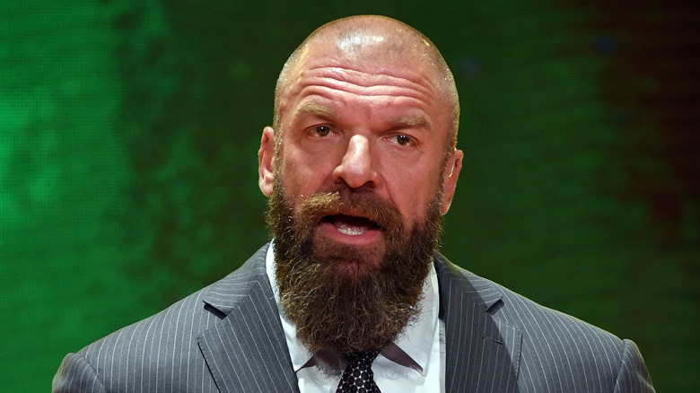 Triple H talking at a press conference 