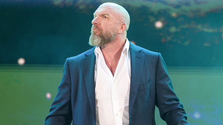 Triple H is wearing a suit