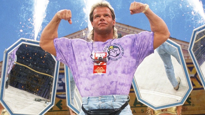 Lex Luger posing at WWE WrestleMania in a t-shirt