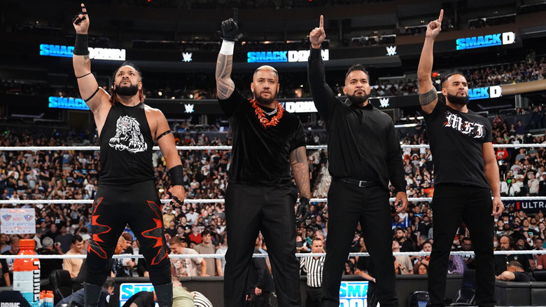 Jacob Fatu, Solo Sikoa, Tonga Loa and Tame Tonga all of the Bloodline hold up the one sign as they stand in the ring during WWE SmackDown at Madison Square Garden on June 28, 2024 in New York City.