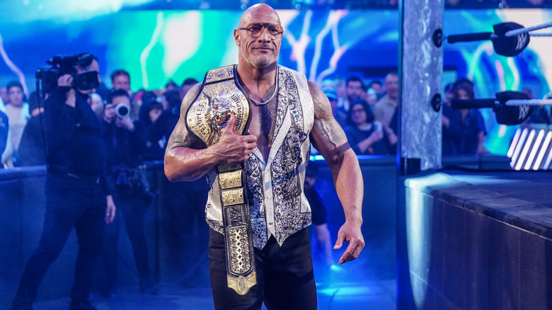 The Rock at ringside with the People's Championship