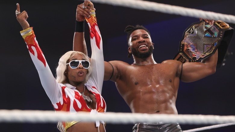 Sexyy Red celebrates with Trick Williams during NXT Battleground