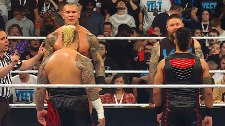Randy Orton and Kevin Owens stare down Solo Sikoa and Tama Tonga in the ring before their match at WWE Backlash.