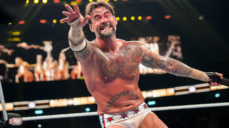 CM Punk reaching