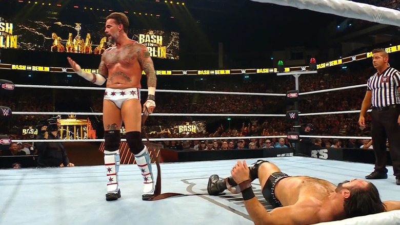 Punk standing over McIntyre