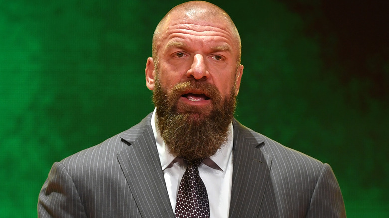 Triple H wearing a suit