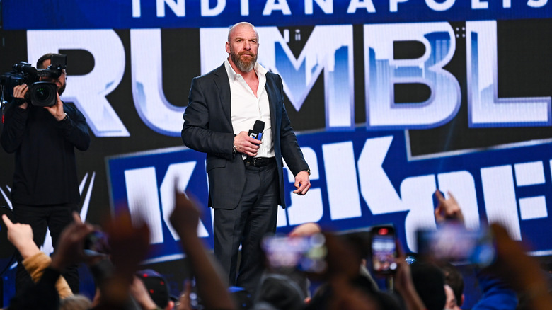 Triple H holding a microphone at the Royal Rumble Kickoff