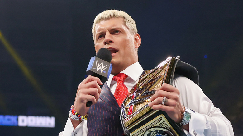 Cody Rhodes holding a mic