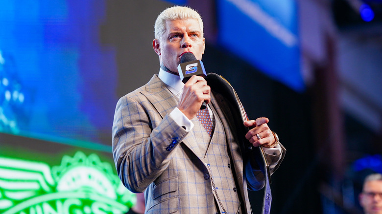 Cody Rhodes holding the Undisputed WWE Championship and a microphone