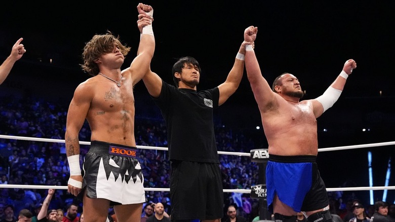 Referee raises hands of HOOK and Samoa Joe