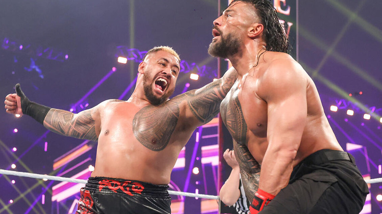 Solo Sikoa prepares to hit the Samoan Spike on Roman Reigns at WWE Crown Jewel.