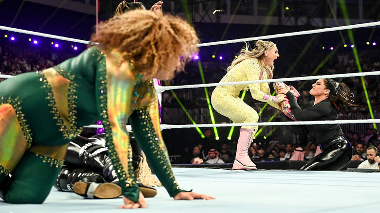 Nia Jax watches as Raquel Rodtriguez prevents Tiffany Stratton from cashing in Money in the Bank at WWE Crown Jewel