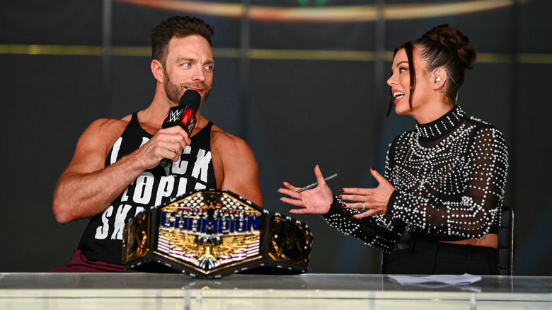 LA Knight smiles with his title belt