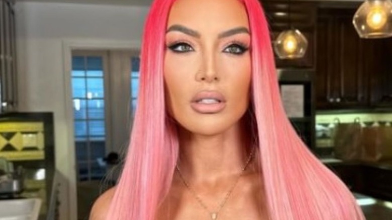 Former WWE Diva Eva Marie poses for the camera with pink hair in a photo posted to her Instagram account.