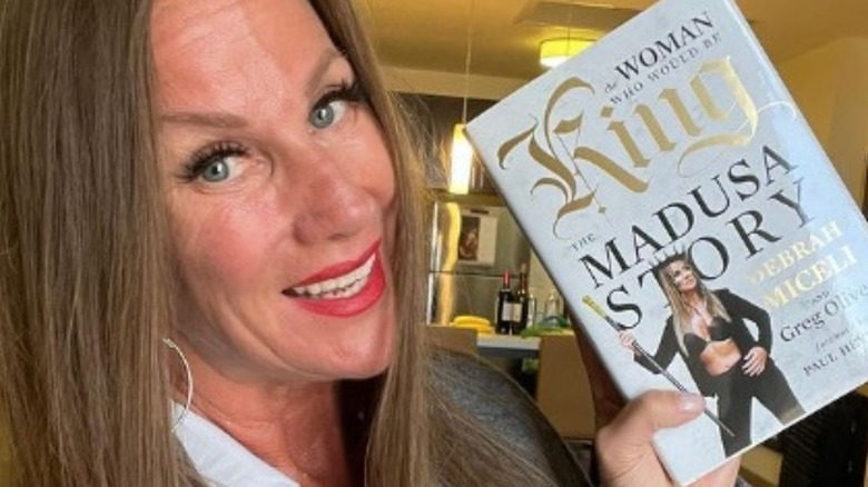 Alundra Blayze poses for an Instagram selfie with her new autobiography "The Woman Who Would Be King."