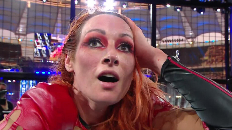 Becky Lynch stands in awe after winning her first Elimination Chamber match.