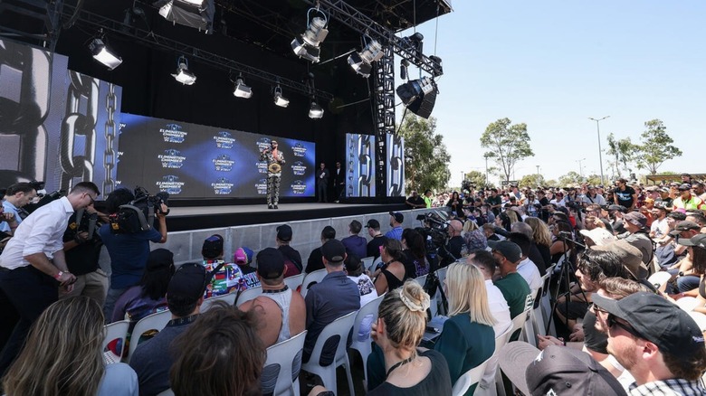 A group of Australian fans listen to Seth Rollins speak at the press conference event for Elimination Chamber 2024.