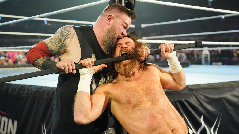 Kevin Owens chokes Sami Zayn