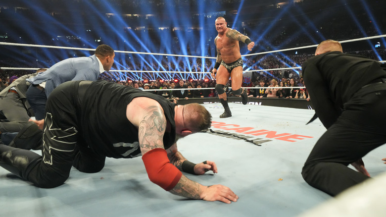 Randy Orton sets up for the punt kick to Kevin Owens