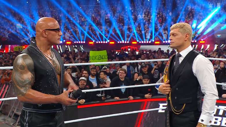 The Rock and Rhodes staring each other down