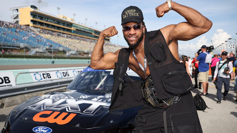 Trick Williams poses with official The CW NASCAR car