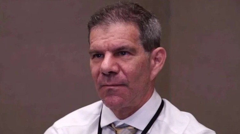 Dave Meltzer awaits a question from the press.