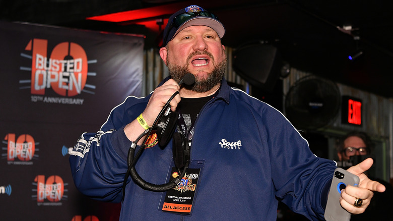 Bully Ray speaking into a mic at a Busted Open event