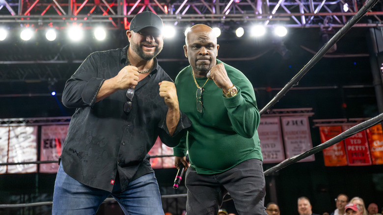 The Dudley Boyz posing in the ring