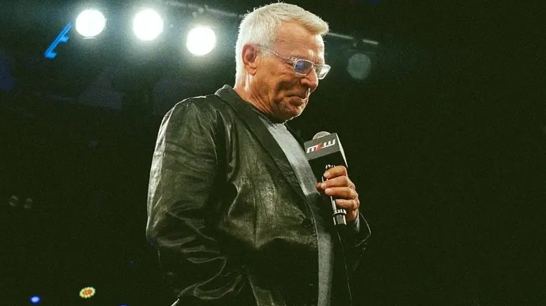 Eric Bischoff snickers at the crowd at a MLW event