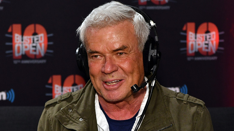 Eric Bischoff smiles on while talking to the 