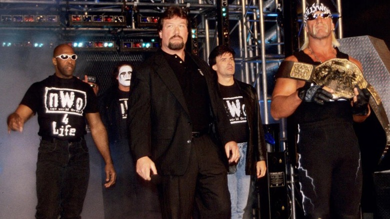 Virgil, Fake Sting, Ted DiBiase, Eric Bischoff, and Hulk Hogan making their entrance during an episode of 