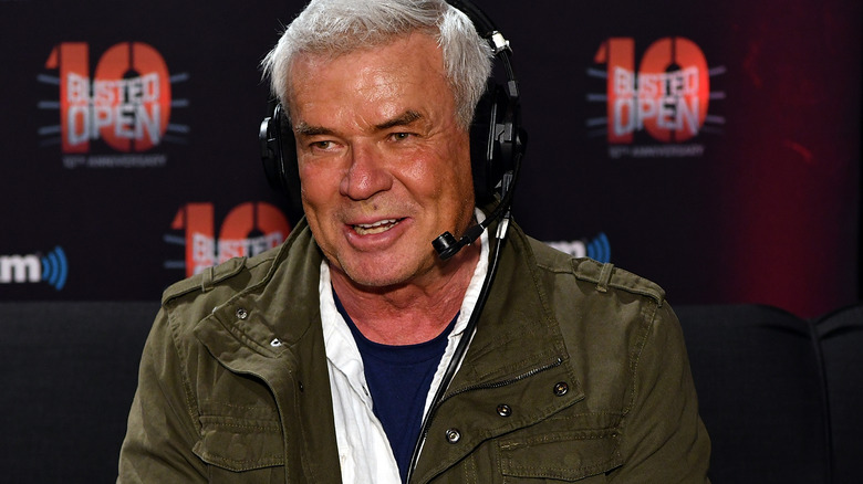 Eric Bischoff speaking into a headset microphone on "Busted Open Radio."