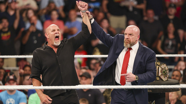 Bill Goldberg poses in the ring with Triple H during Bad Blood at State Farm Arena on October 5, 2024 in Atlanta, Georgia.