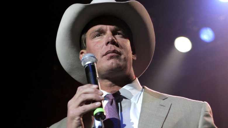 JBL holds a microphone