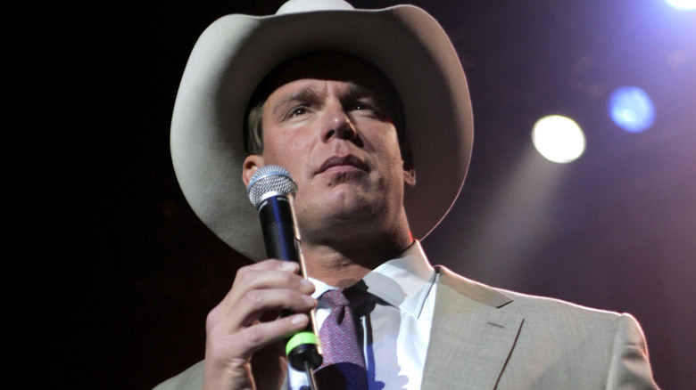 JBL holds a microphone