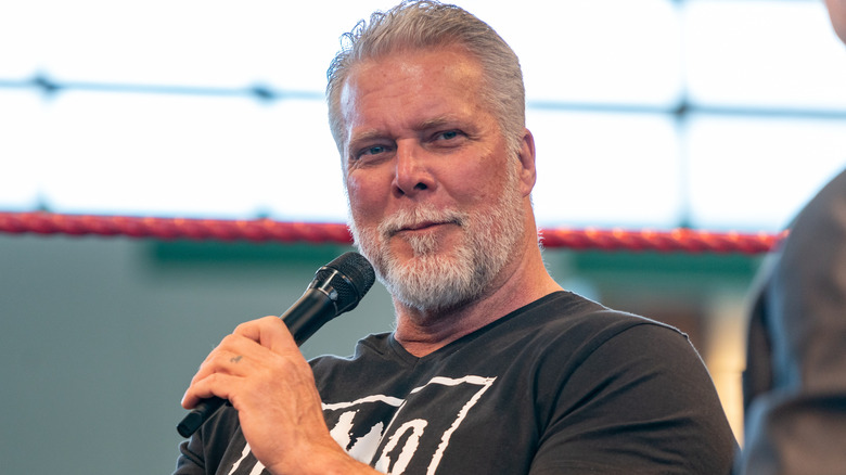 Kevin Nash holding a microphone