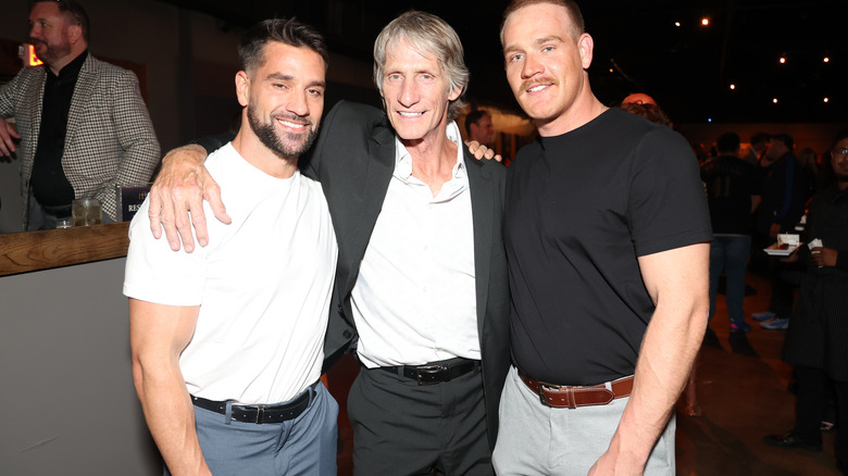 Ross and Marshall Von Erich pose with their father, Kevin.